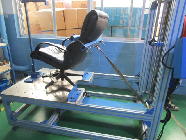 A chair positioned in a mechanical test fixture